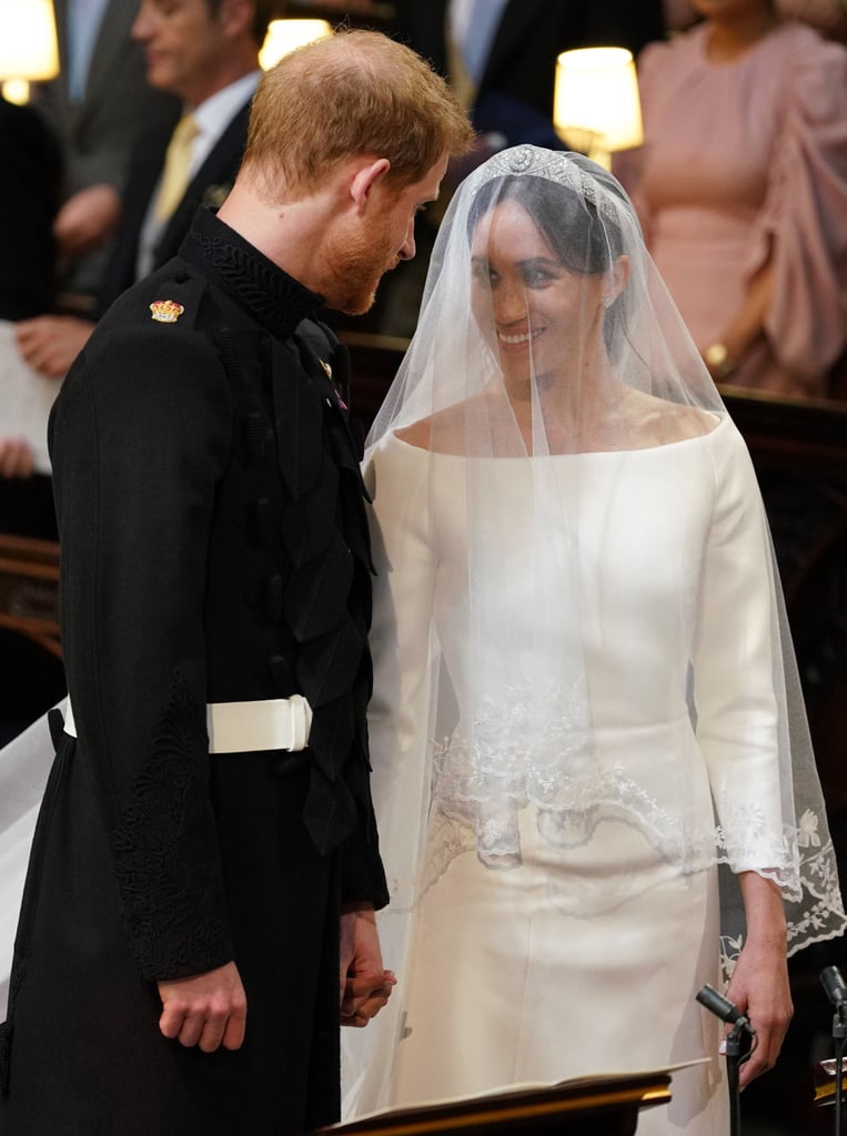 She accessorised her gown with a diamond-encrusted bandeau tiara, sparkling jewels, and a cathedral-length veil, which represented the distinctive flora of each Commonwealth country.