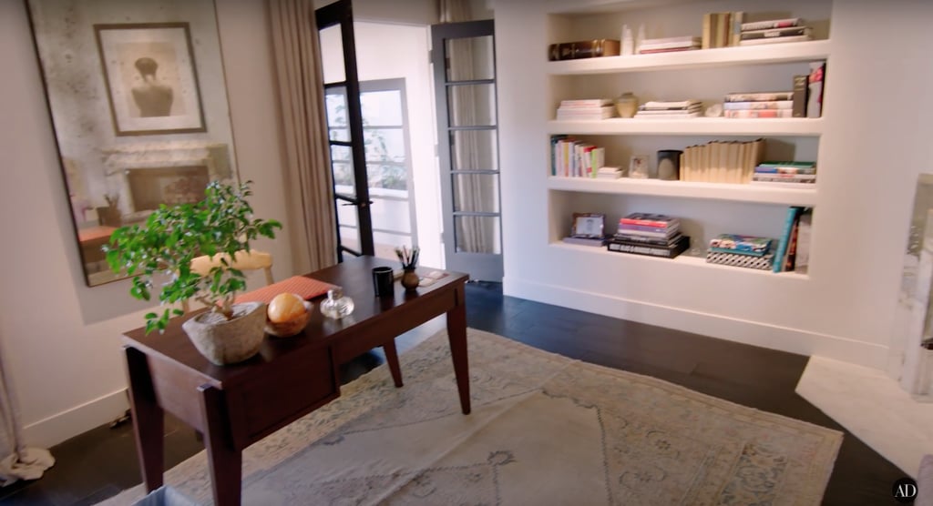 Kendall's office space is simple and unfussy, with built-in bookshelves and a small wooden desk.