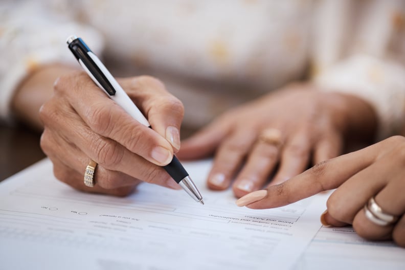 two people signing agreement