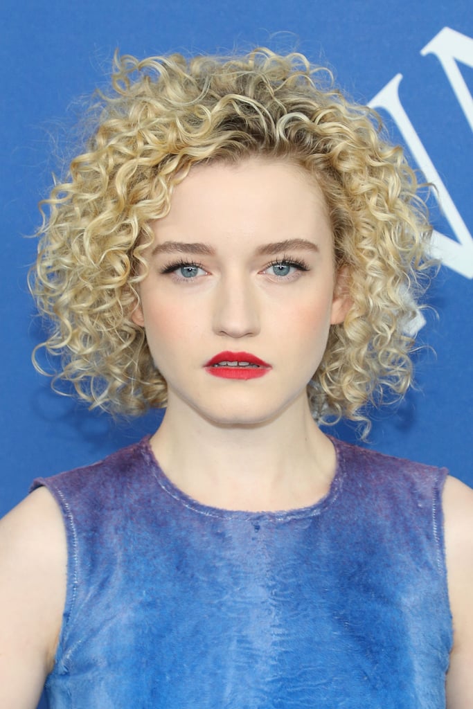 "The shag is a haircut that builds volume around the face, and is almost always best with curly hair," said Cash Lawless, a NYC-based celebrity stylist who has worked with Mandy Moore and Evan Rachel Wood. "It's popular right now as more and more women are embracing their curls." 
That said, it is possible for those with fine, thin, or superstraight hair to pull off this edgy look — with the help of a perfect air-dry. A pro tip from Lawless: "Air-drying can be a volume-killer, so tease the roots around your crown up with a comb to bring life back into the hair." 
Vercher added that before you air-dry, add in some texture spray to separate the strands. This ensures that your hair looks choppy, piece-y, and ready for The Deuce central casting. Once your hair is no longer wet, Lawless likes to spritz in dry shampoo at the roots as a final tszuj for extra volume.
