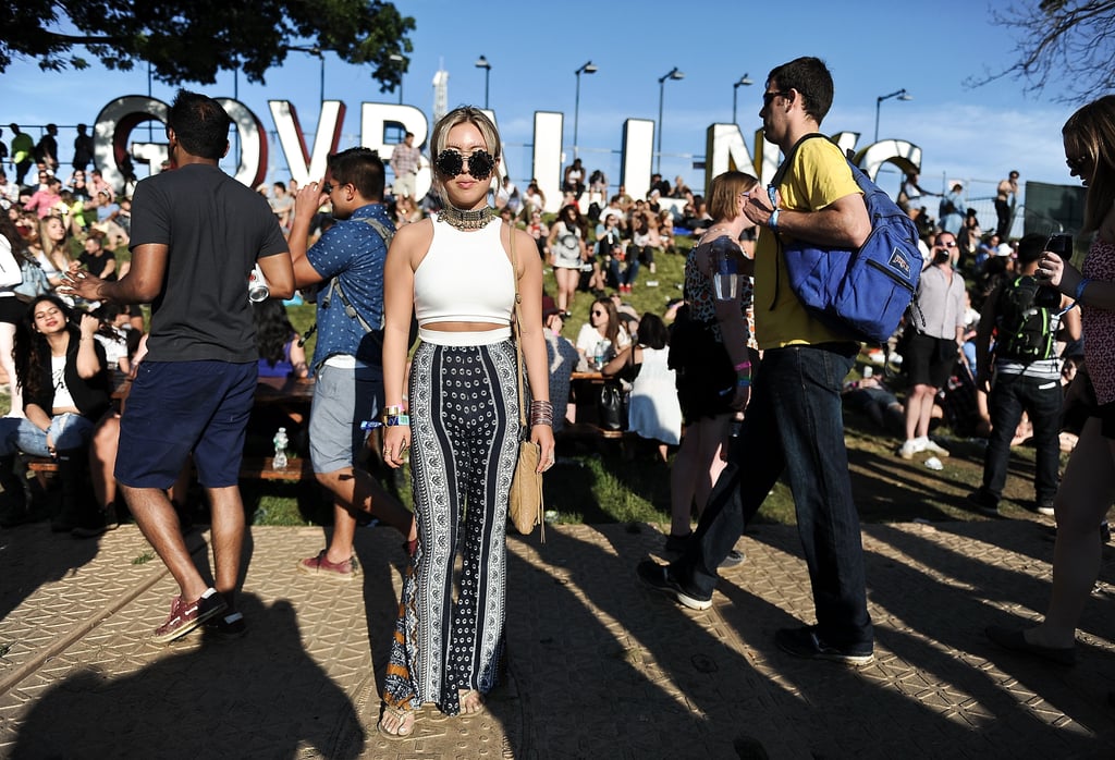 Printed wide-leg pants, a crop top, and round sunglasses made for a cool party uniform.