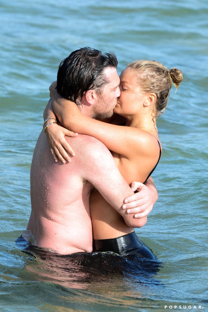 Sam Worthington and Lara Bingle showed love at the beach in Sydney back in October 2013.