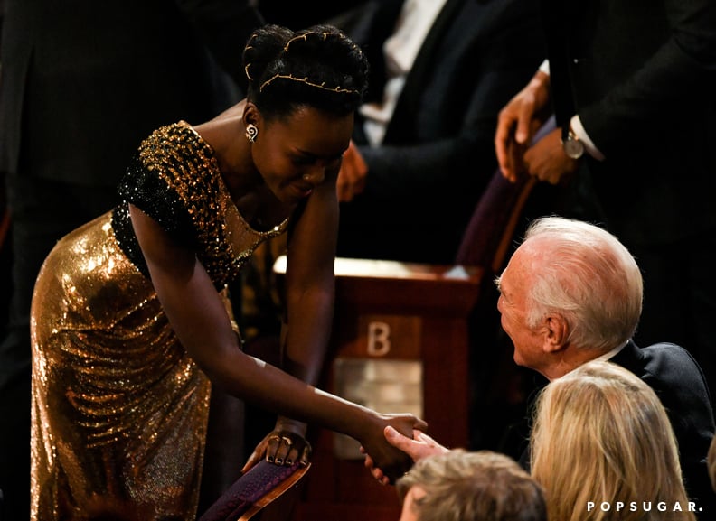 Lupita Nyong'o shook hands with Christopher Plummer.