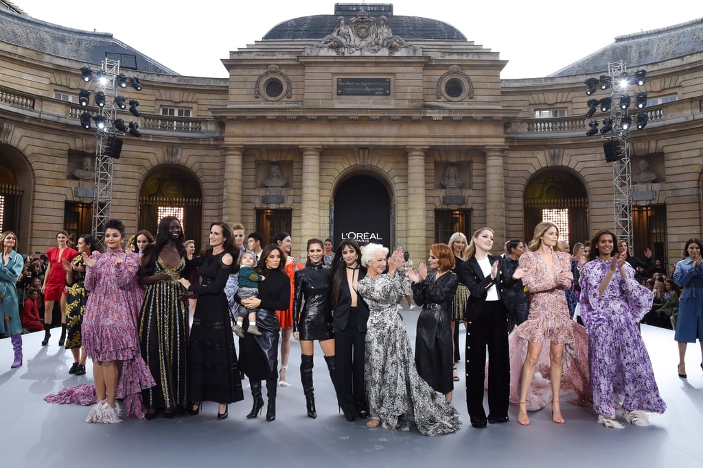 Camila posing at the end of the "Le Defile L'Oreal Paris" fashion show beside (from right to left) Aishwarya Rai, Andie MacDowell, Eva Longoria and her son Santiago, Helen Mirren, Amber Heard, Doutzen Kroes, Liya Kebede and several models.