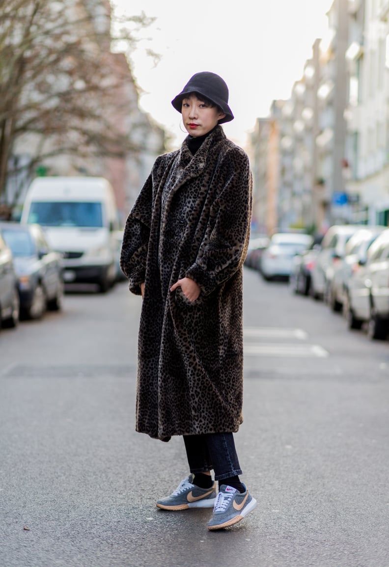 Style Your Leopard-Print Coat With: A Bucket Hat and Sneakers