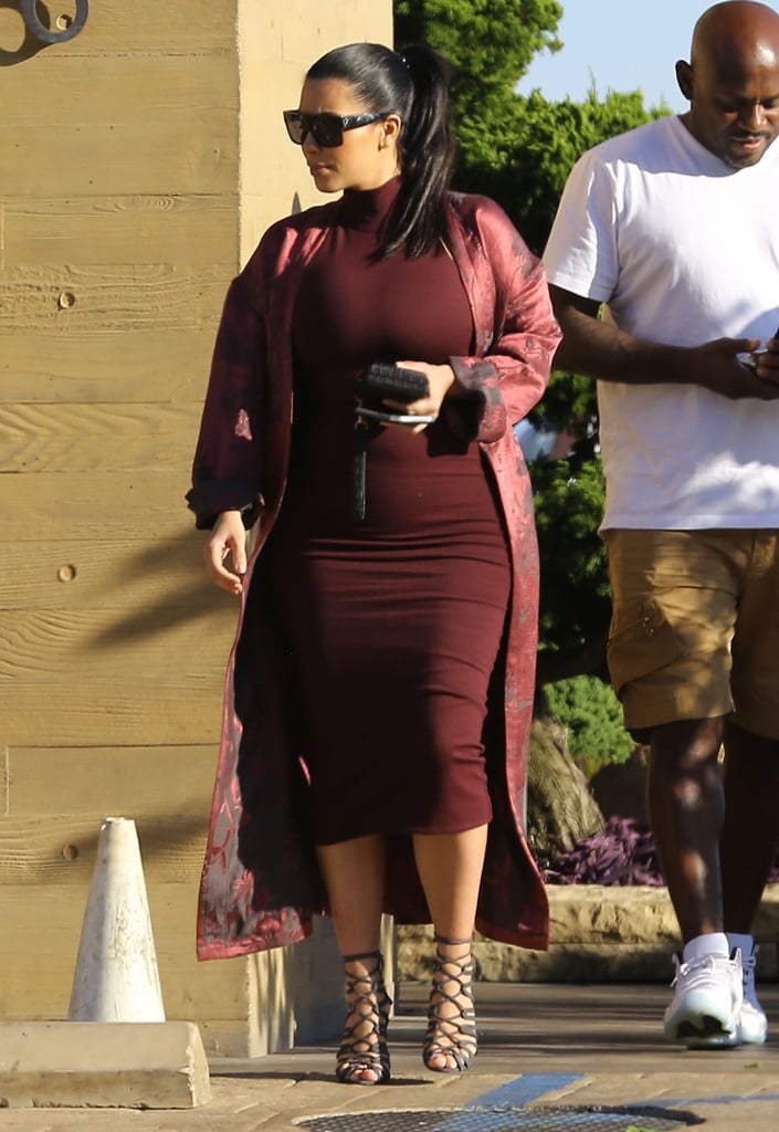 Kim pulled off this cranberry look with a satin robe.