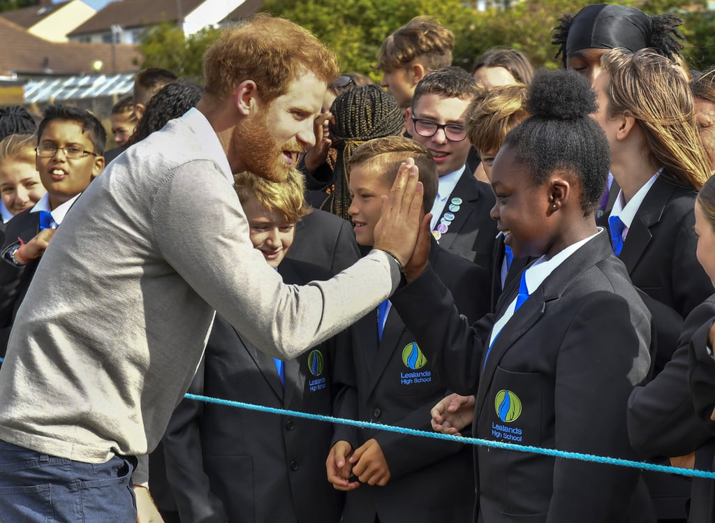 Prince Harry Hugs Kids at Lealands High School