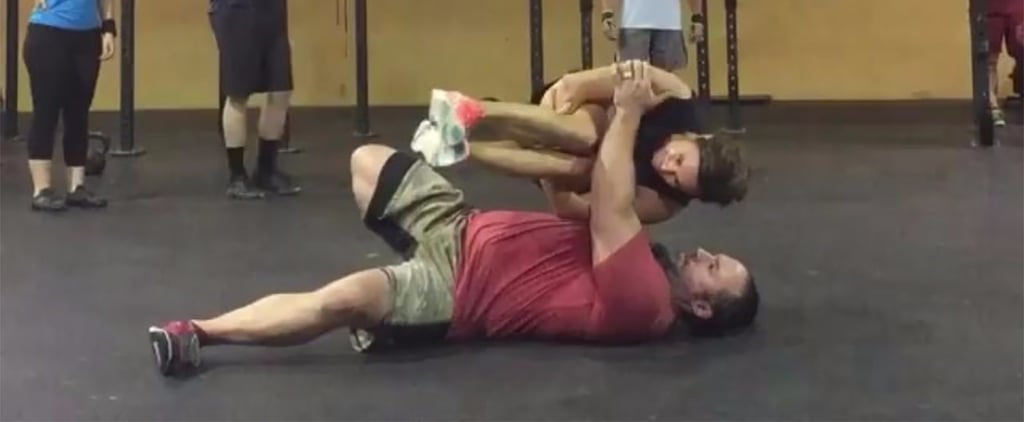 Man Does Turkish Get-Ups Holding a Woman