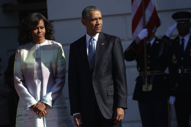 WASHINGTON, DC - APRIL 28:  (AFP OUT) U.S. President Barack Obama (R) and first lady Michelle Obama (L) wait for the arrival of Japanese Prime Minister Shinzo Abe and his wife Akie Abe during an official arrival ceremony at the South Lawn of the White Hou
