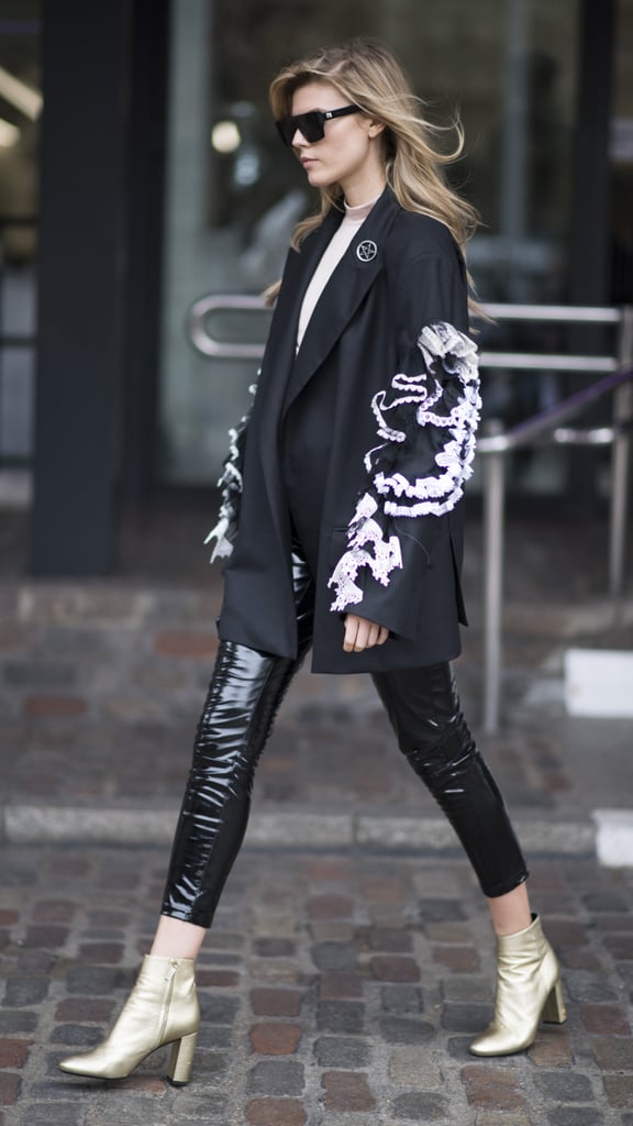 With a voluminous jacket and boots that show a hint of ankle.
