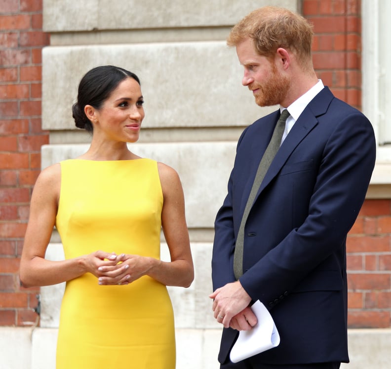 Britain's Prince Harry, Duke of Sussex (R), Britain's Meghan, Duchess of Sussex arrive to attend a reception marking the culmination of the Commonwealth Secretariats Youth Leadership Workshop, at Marlborough House in London on July 5, 2018. (Photo by Yui 