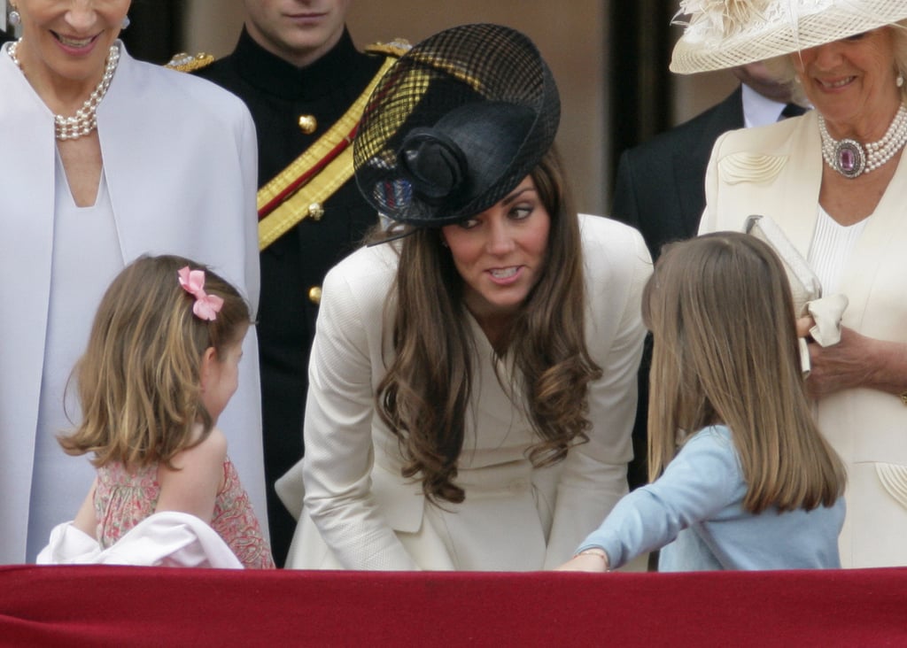 Kate looked very maternal while talking to two young royals, Estella and Eloise Taylor, at the queen's official birthday parade in London on June 2011. We wonder what she was saying to the little girls!