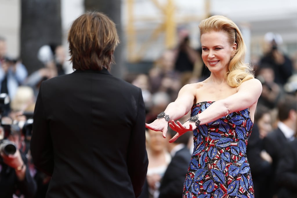Nicole reached out for Keith's hands when they walked the red carpet at the Cannes Film Festival in May 2013.