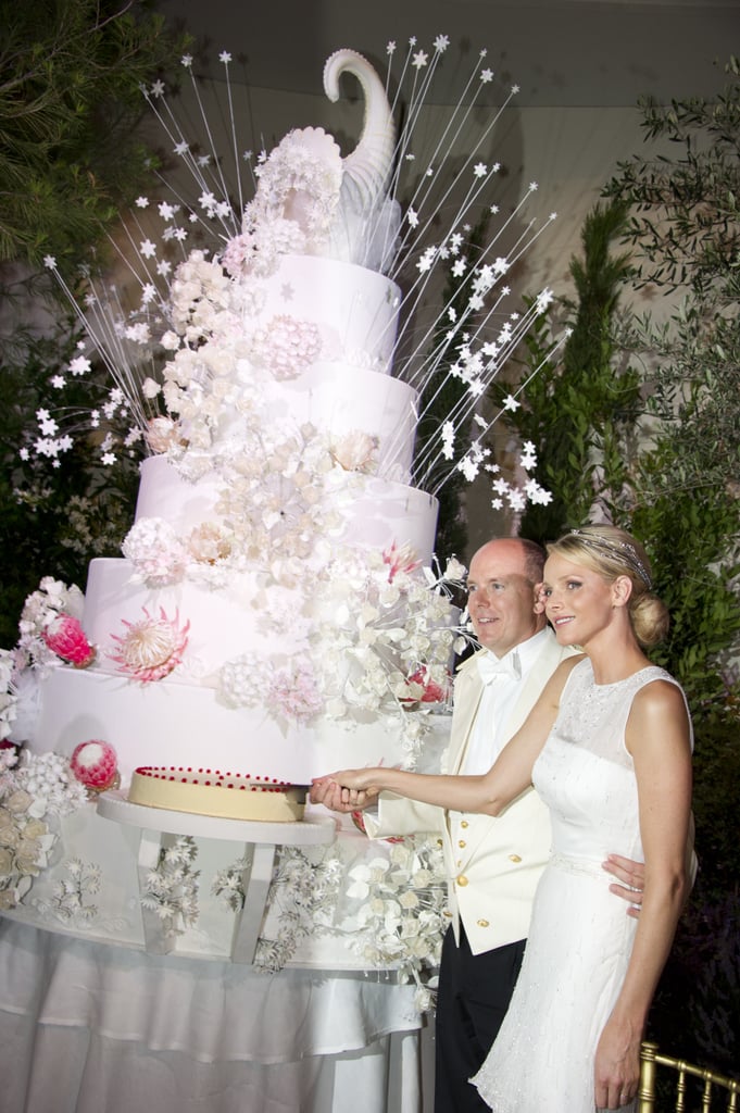 Their wedding cake was the centerpiece of the reception. In addition to the 110 pounds of strawberries, the cake also featured 2,000 edible flowers including Proteas, South Africa's national flower. Most of the ingredients were picked from Roc Agel, the estate that Monaco's Prince Rainier III gave to Grace Kelly as a wedding present in 1956. 
The wedding almost didn't happen. Just a week before the lavish affair, it was reported that the former South African Olympic swimmer, who was 33 at the time, tried to escape Monaco and had her passport seized by police at the airport in France. The alleged attempt came amid rumors that Albert had fathered an illegitimate child when they were together. Charlene later dispelled those rumors, telling Vogue in 2011, "It is a shame that those rumors came at such a bad time, but I think they were timed to sabotage such a happy occasion. They are categorical lies. I won’t dignify them with any response other than to say that the photographs of me and Albert in love and getting married will speak louder than any vicious gossip and empty rumors.”