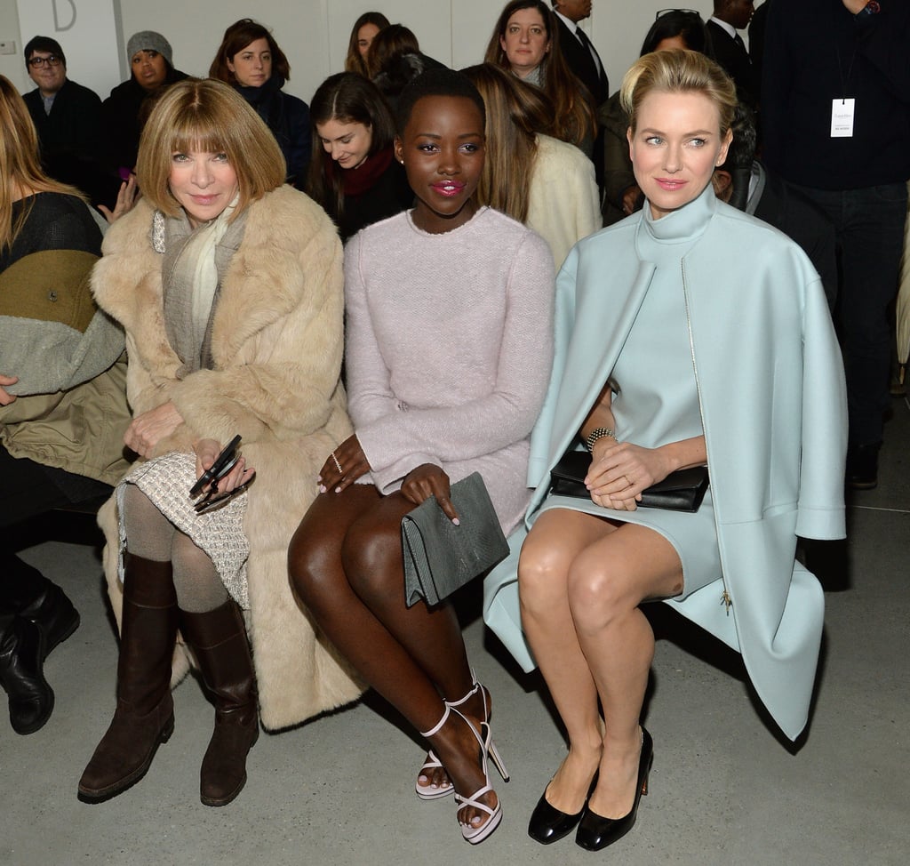 Lupita Nyong'o made her New York Fashion Week debut at the Calvin Klein Fall 2014 show on Thursday, sitting next to Naomi Watts and Anna Wintour.