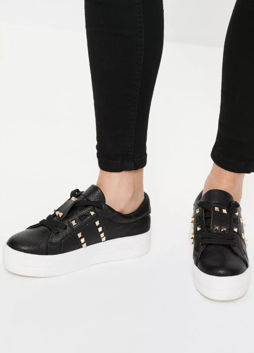 black sneakers with spikes