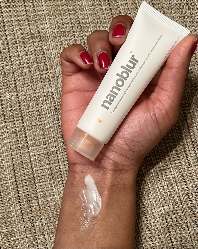 The Indeed Labs Nanoblur Cream in a hand with the product showcased on the wrist