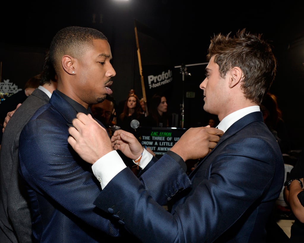 Zac Efron and his That Awkward Moment costar Michael B. Jordan straightened each other's ties before taking the stage with their costar Miles Teller.