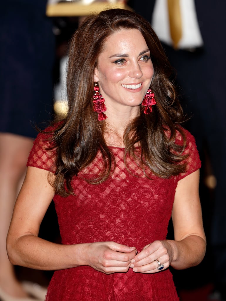 Kate also accessorised her Marchesa Notte gown with red Kate Spade statement earrings as she attended the opening night of 42nd Street at the Theatre Royal in April 2017.