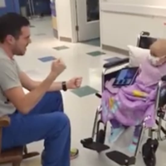 Male Nurse Singing to Little Girl With Cancer