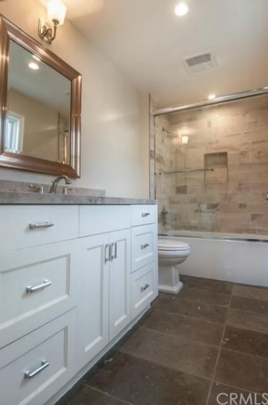 Though the home is simple, we love the little details (like these bathroom fixtures).