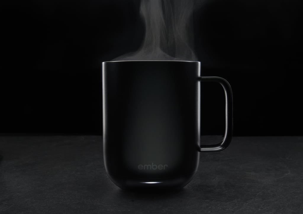 Available in white or — my favorite — matte black, the sleek mug comes with a charging coaster and pairs with an app that allows you to pick your ideal temperature and add preset temperatures. It also notifies you when your drink is perfectly heated. If you don't want to bother with the app or don't own a smartphone, it still works. The mug will just default to 130 degrees. 
It isn't dishwasher safe — a warning to the dishwasher dependent! But so far, it hasn't been a pain to handwash. You do want to keep the charging coaster completely dry at all times, so it's important to make sure to dry the bottom of the mug thoroughly before charging it again. 
It also feels really good in the hand, not clunky or heavy despite the technology. It might seem a little small if you're used to large mugs and heavy pours; it only holds 10 ounces of liquid. A tall coffee from Starbucks, for comparison, holds 12 ounces.