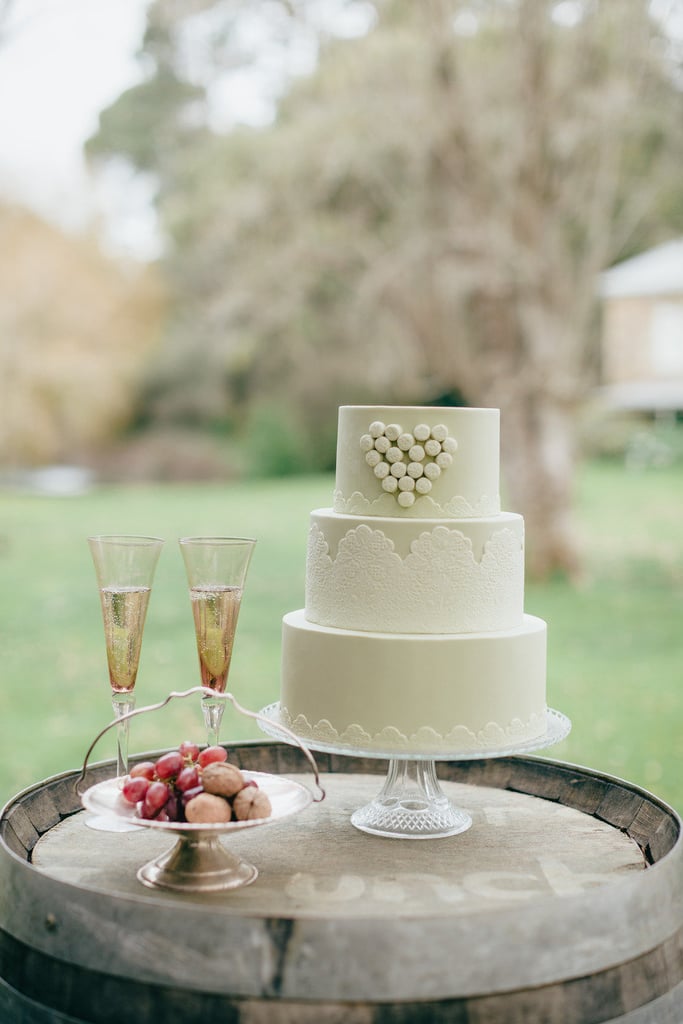 Hearts and lace — does it get any girlier than that? We love the sweet touch this cake adds to the reception. 
Photo by Eon Images via Style Me Pretty