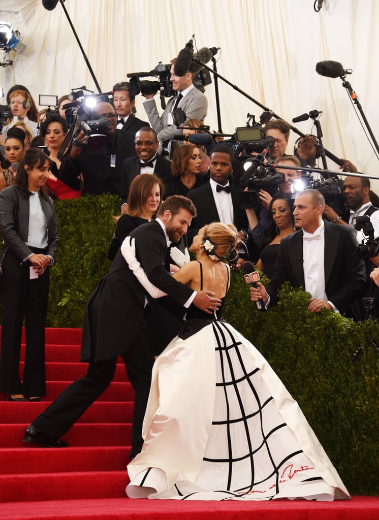 Cochairs Bradley Cooper and Sarah Jessica Parker stopped to greet each other on the stairs.