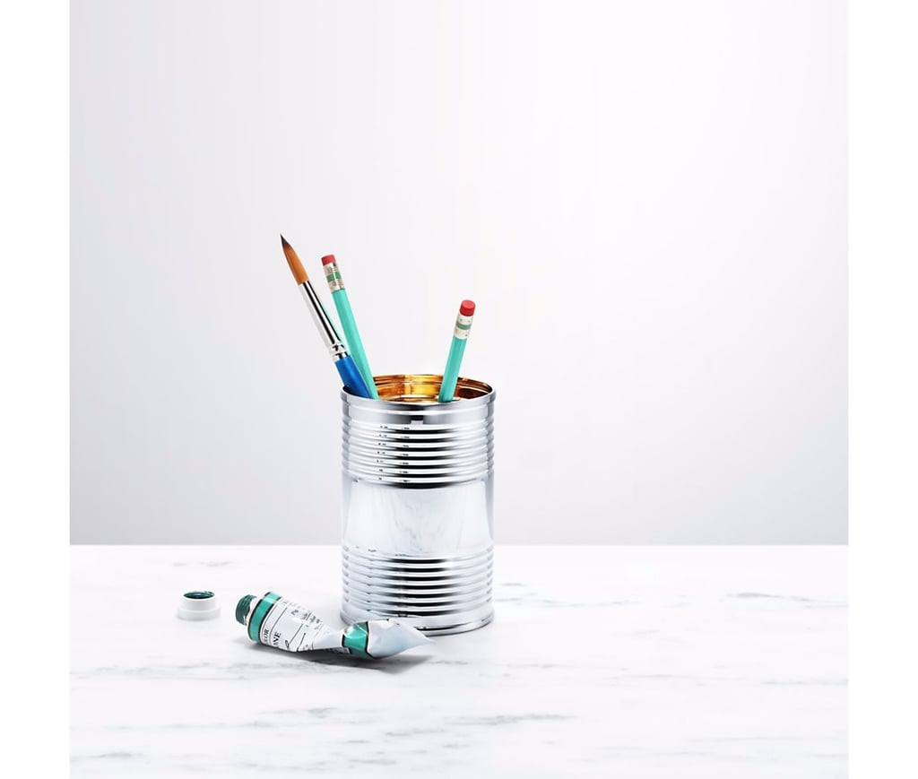 Upgrade your pencil, pen, and paintbrush storage with a sterling and vermeil tin can ($1,000), complete with Tiffany's signature blue enamel accent.