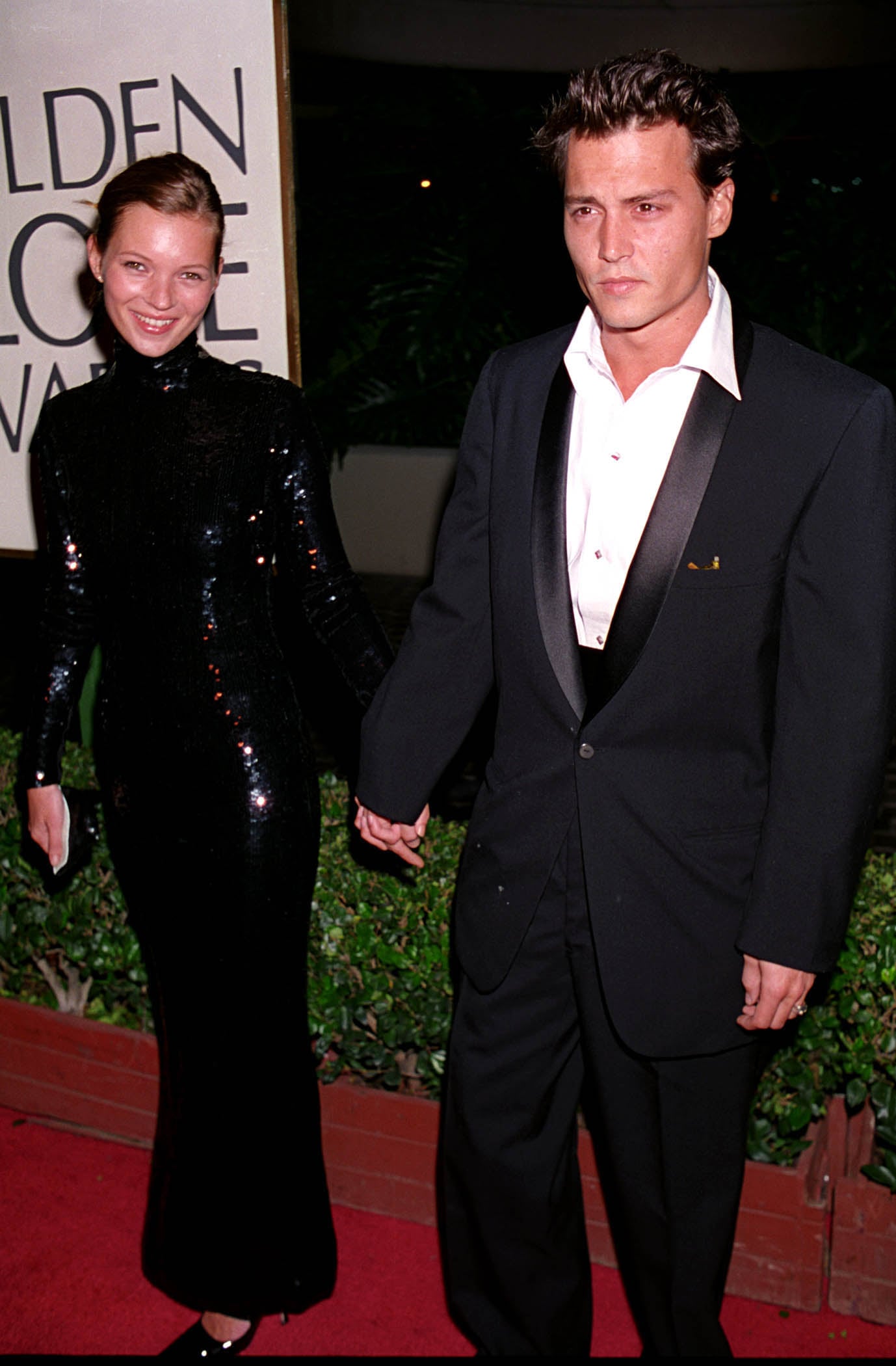 Even in the early days, Kate knew how dramatic an all-black look can be, opting for all-over sequins for the 1995 Golden Globe Awards. Of course, she had the best accessory to finish the look. Johnny Depp makes everything look better!