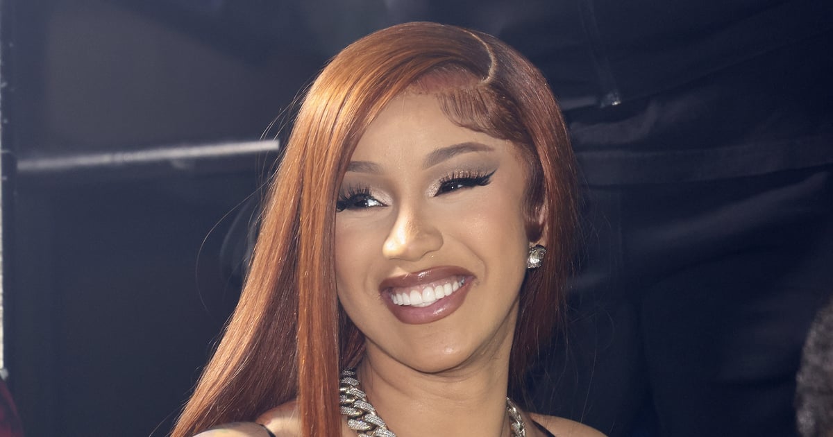 Cardi B’s Black Fishnet Sheer Catsuit in Miami