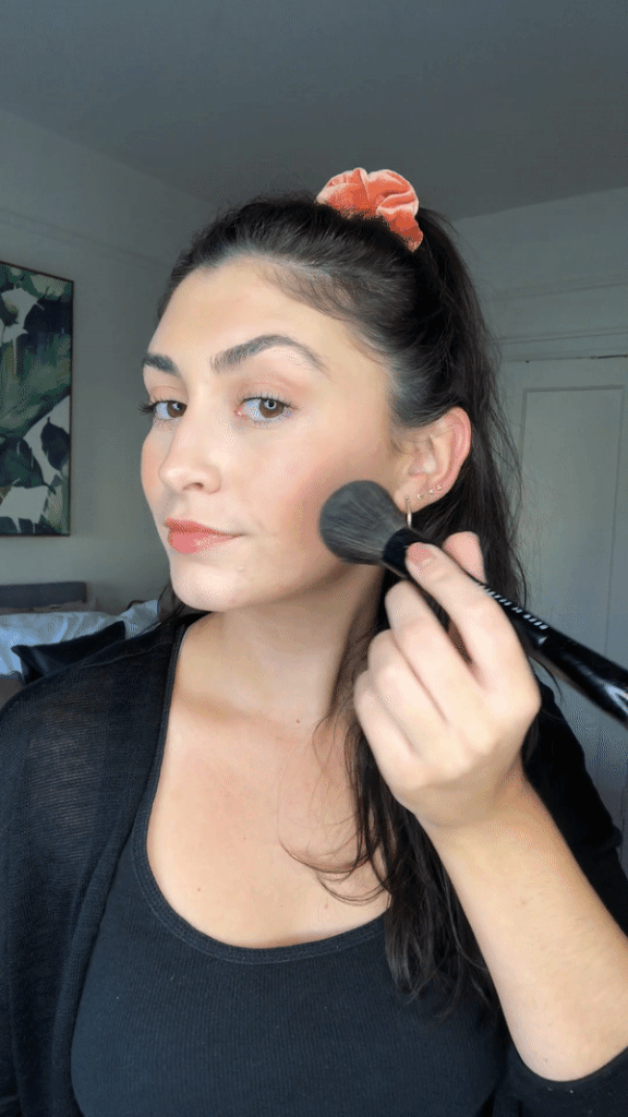 Because the formula is a liquid, it swipes onto the skin fairly pigmented at first but after blending (and blending, and blending. . .) onto my cheeks, along my jaw, and on my temples, I was left with a natural-looking bronzed glow. (At the risk of sounding like I'm glorifying tanning without sunscreen I won't say sun-kissed, but it was kind of like that.) The spray bronzer doesn't streak or look patchy and dries to a nice soft finish. The formula is very forgiving — more forgiving than some powder or creams that I've tried — and doesn't go on too heavy with one application so you can build up the color. 
My one disclaimer is that the step where you spray the bronzer onto your brush can get a little messy. It's no big deal, but I recommend doing it over the bathroom sink so that you can wipe away any falling residue.