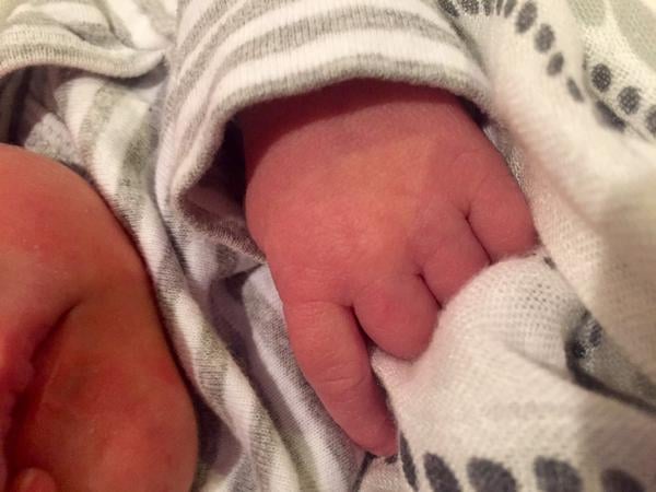 The singer tweeted this precious photo of Isaiah to announce his birth.