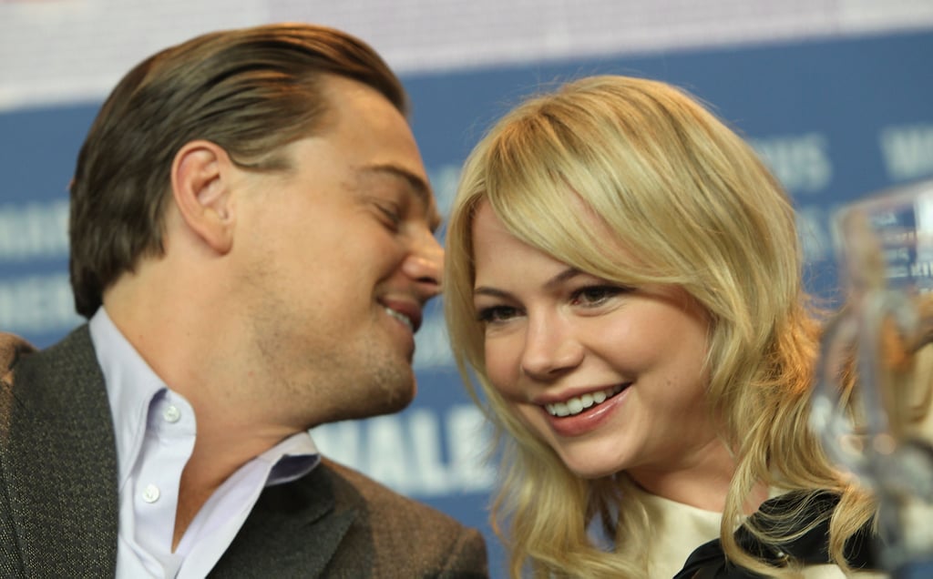 Leo laughed with Michelle Williams at a press conference for Shutter Island in February 2010.