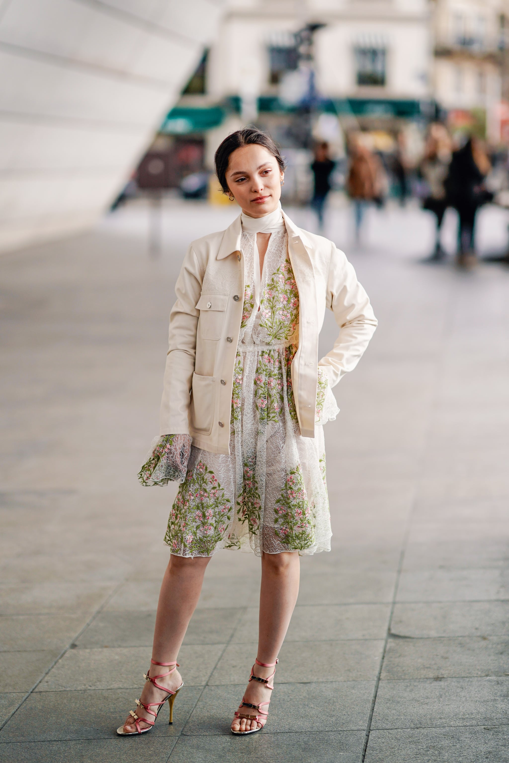 Pair your sandals with a printed dress and white jacket. The