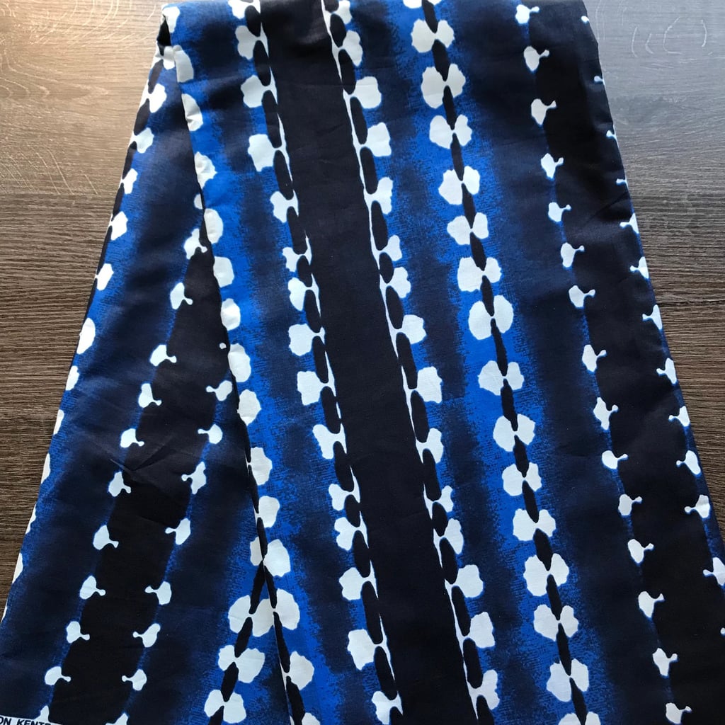 To make the Agojie skirt, use an oversize scarf with a bold print ($10, originally $13). Or, dip a potato or sponge into white paint to use as a stamp for creating your own pattern on a cloth or towel. Alternatively, you could wear biker shorts to mimic the pants worn underneath the warriors' striped training tunics.
