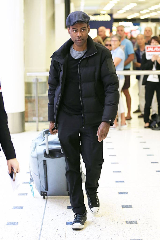 Chris Rock landed in Sydney, Australia, solo on Wednesday.