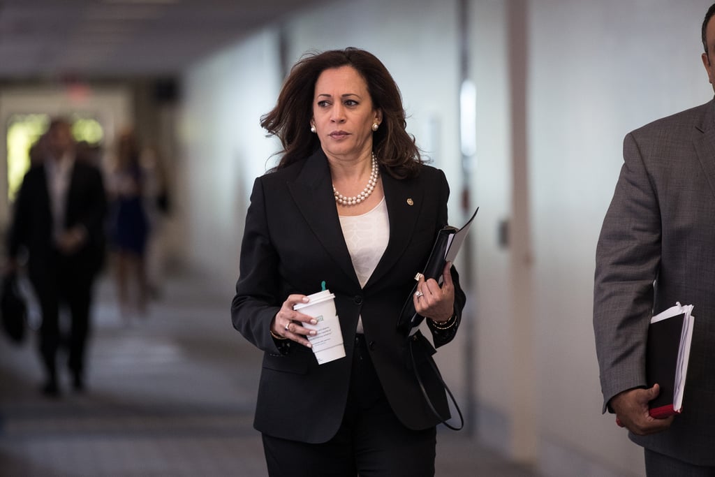 Senator Kamala Harris arrived for a meeting in Washington DC in June 2017 in a satin embroidered top, pearls, and a black pantsuit, and also armed with her coffee cup. Senator Kamala Harris arrived for a meeting in Washington DC in June 2017 in a satin embroidered top, pearls, and a black pantsuit, and also armed with her coffee cup.