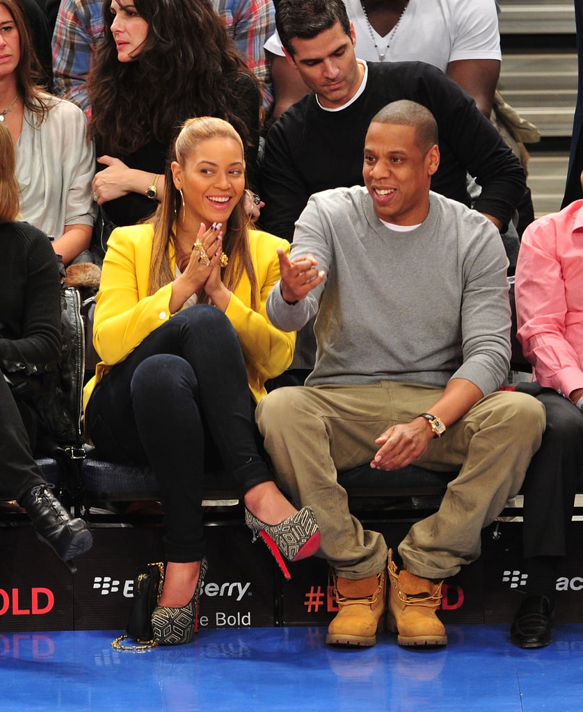 While sitting courtside at a New York Knicks game in February 2012, Beyoncé shone in a bright yellow Rag & Bone blazer and printed platform pumps and JAY-Z kept it casual in a gray sweatshirt and khaki pants.