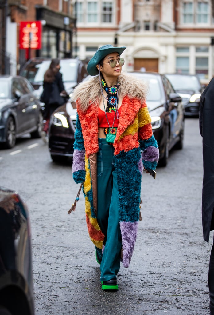 This outfit looks eclectic instead of costumey because of the thoughtful pairings of indigo blue at the top and bottom, with oranges and reds as a focal point to the centre.