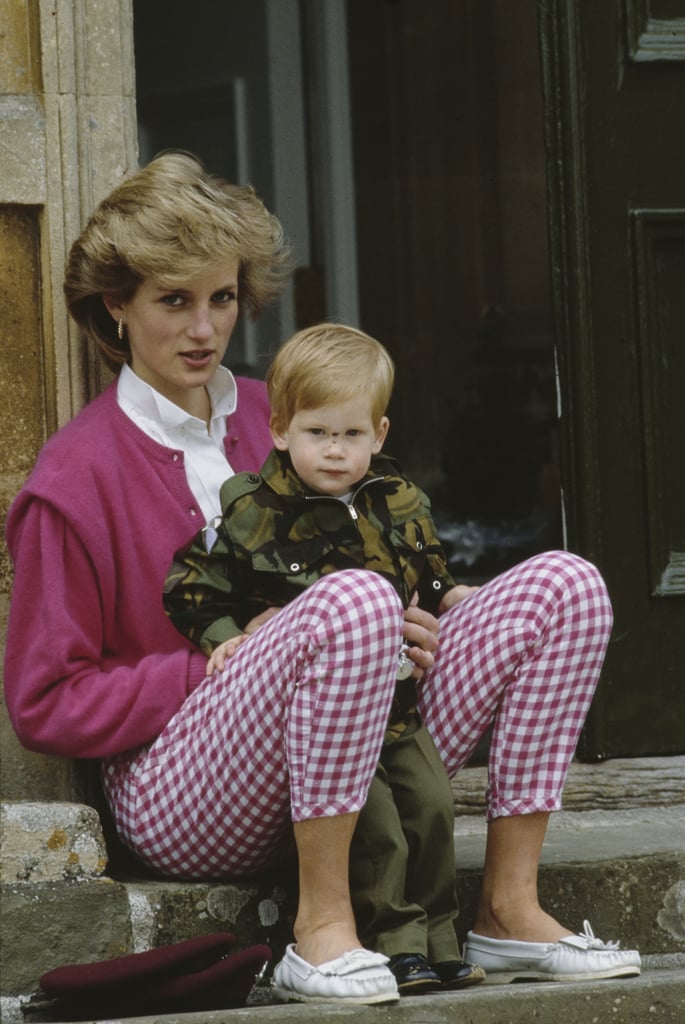 Prince Harry sat on his mum's lap on the steps of the Highgrove Estate in Gloucestershire in July 1986.