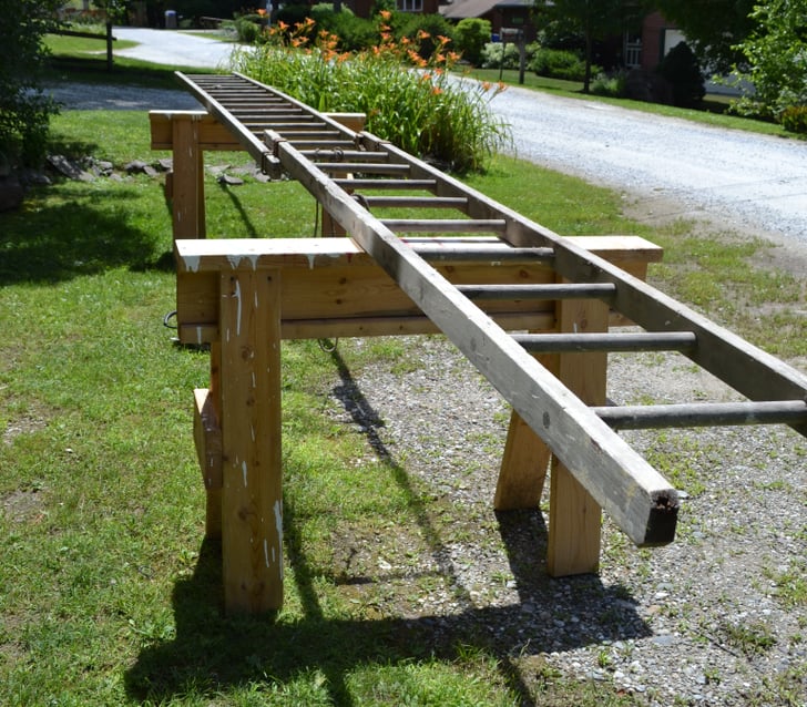 Lay out your ladder on saw horses to get an idea of what size you DIY Ladder Chandelier