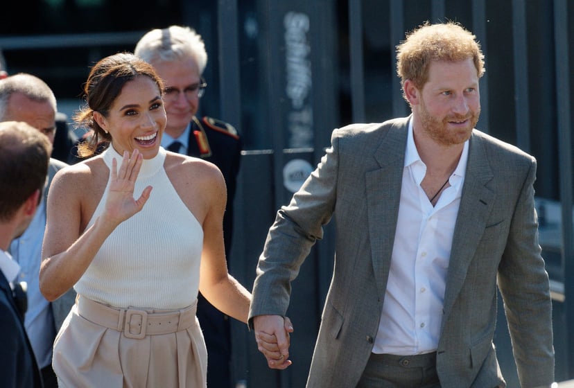 06 September 2022, North Rhine-Westphalia, Duesseldorf: Britain's Prince Harry (r), Duke of Sussex, and his wife Meghan, Duchess of Sussex, walk to a car after taking a boat trip on the Rhine. (recrop) The prince and his wife are coming to Düsseldorf to p