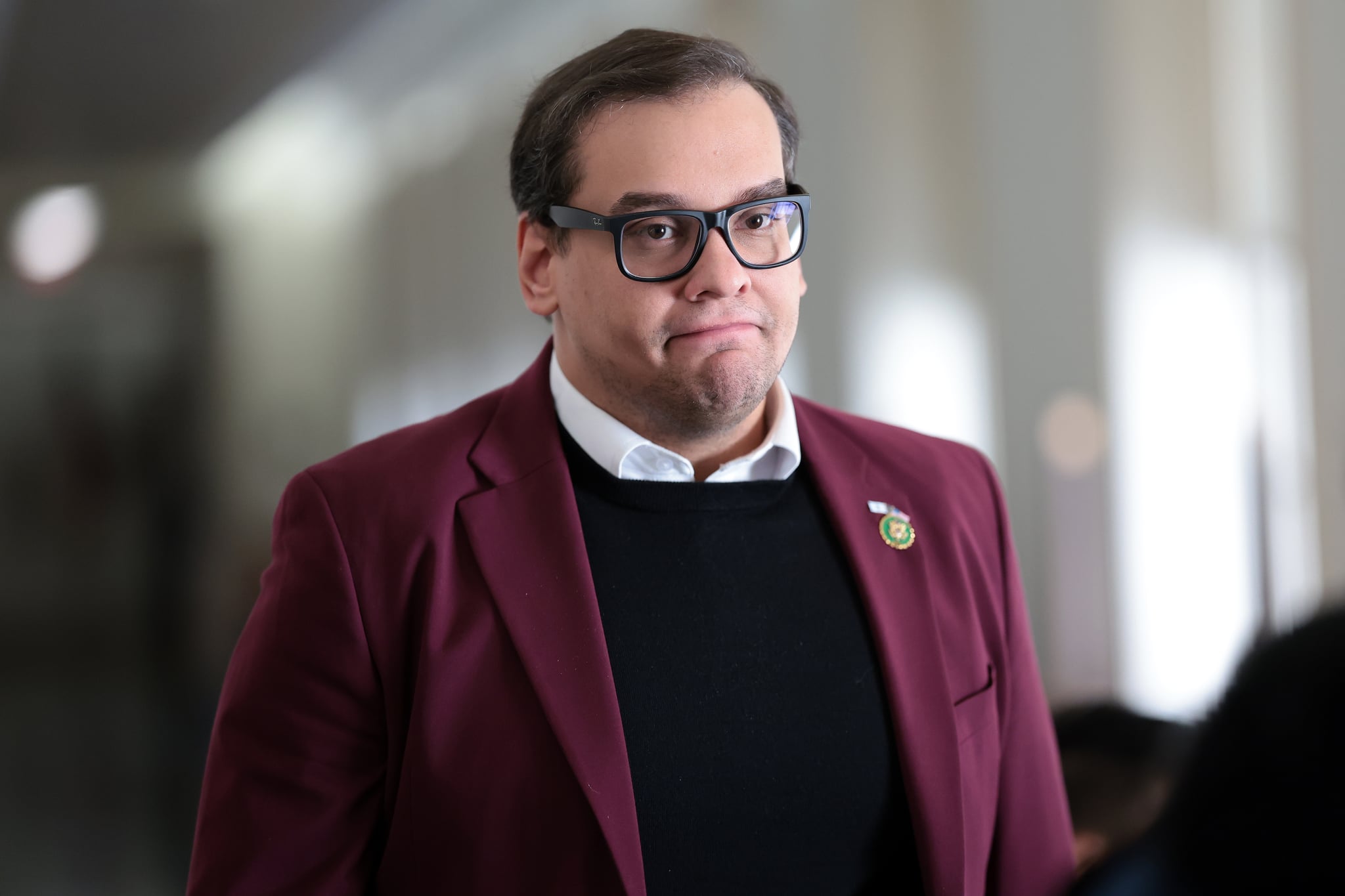 WASHINGTON, DC - OCTOBER 13: U.S. Rep. George Santos (R-NY) returns to a House Republican caucus meeting at the Longworth House Office Building on October 13, 2023 in Washington, DC. House Republicans continue to debate their pick for Speaker after their initial nominee, Rep. Steve Scalise (R-LA), withdrew his name from the race after failing to secure the number of votes needed. The full House of Representatives is expected to vote on a replacement for former Speaker Kevin McCarthy (R-CA) after he was ousted last week. (Photo by Win McNamee/Getty Images)