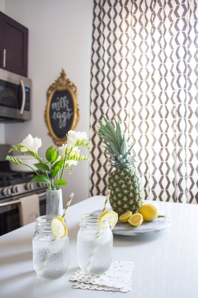 This tiny kitchen makes up in style for what it lacks in space. A mod black-and-white palette keeps it looking sleek.