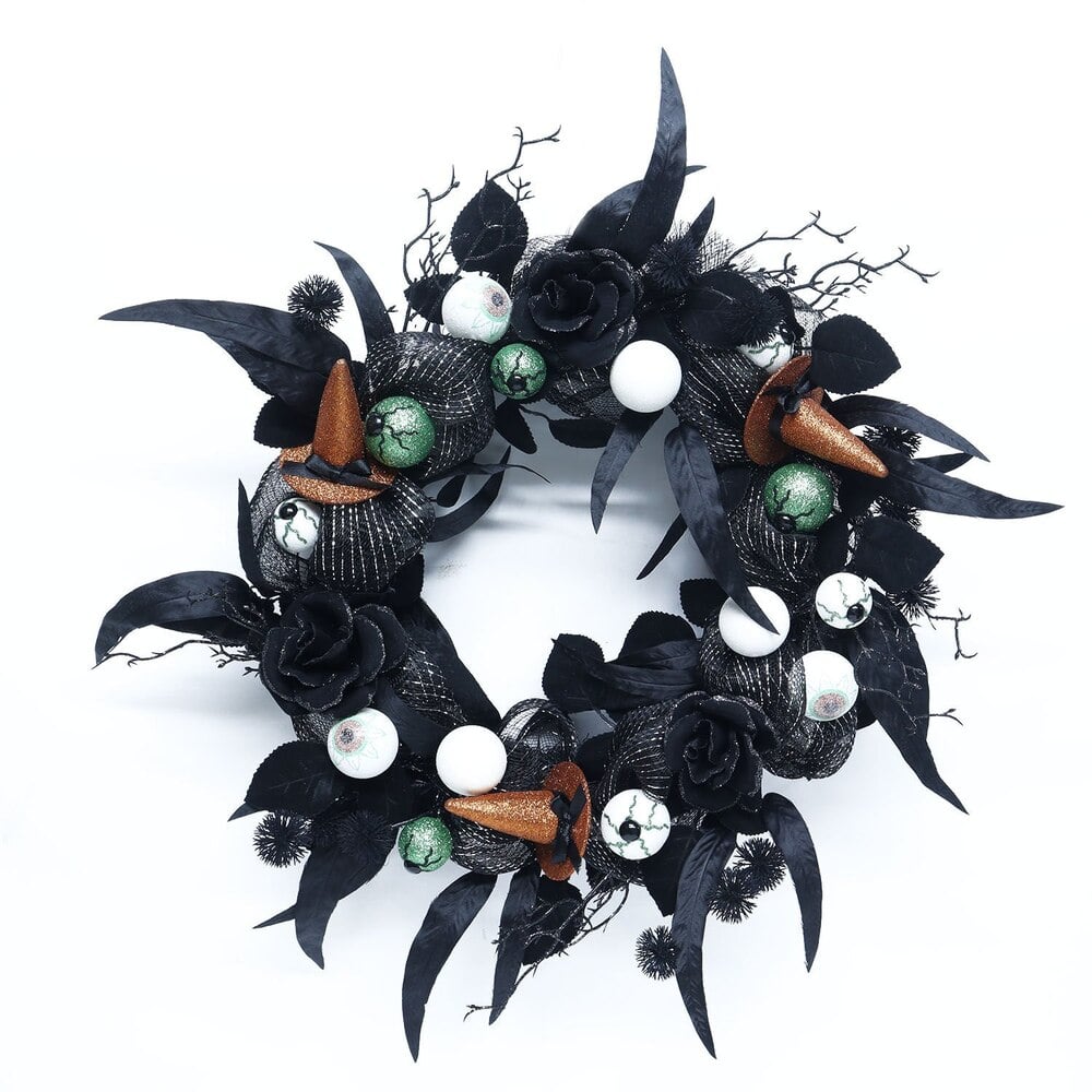 Joyward Witches & Eyes 22" Wreath ($30)
Bring the spooky vibes right to your doorstep with this decked-out wreath. Complete with black mesh, glittery witch hats, and eyeballs, it's the spooky accent that will instantly transform your entryway. Plus, it's by far one of the easiest decorations in terms of assembly.