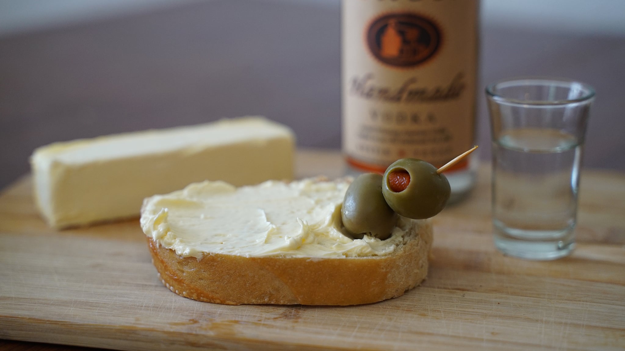 vodka butter on bread with olives