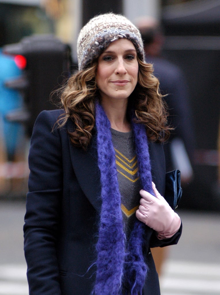 While in Paris in season six, Carrie tucks her curls under a cap, allowing her sexy smoky eye to shine.