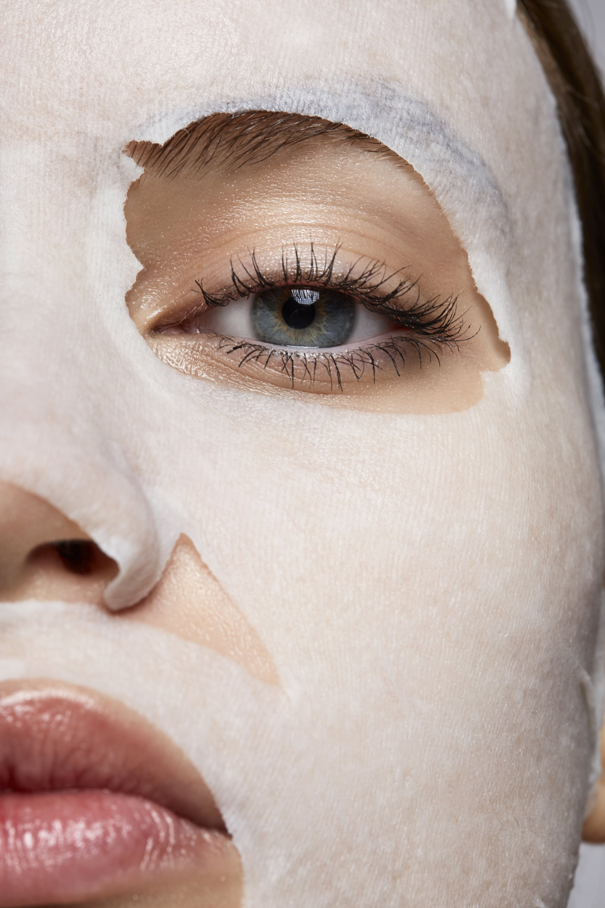 woman wearing a korean facial sheet mask