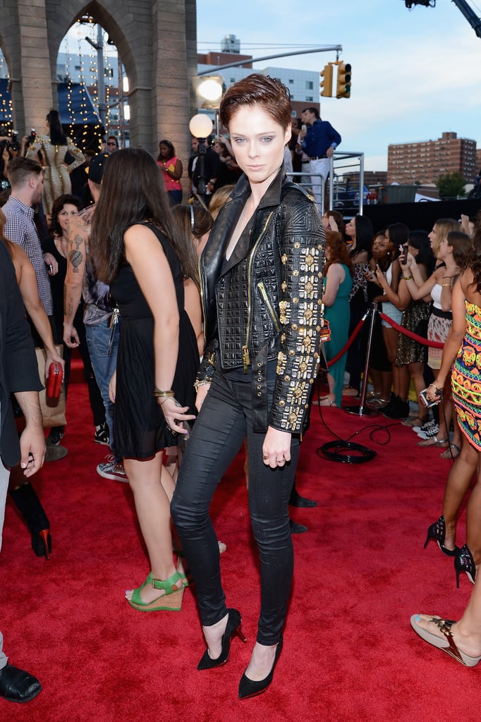 Coco Rocha took her look to rocker heights in a black embellished leather Fausto Puglisi biker jacket and slim black jeans.